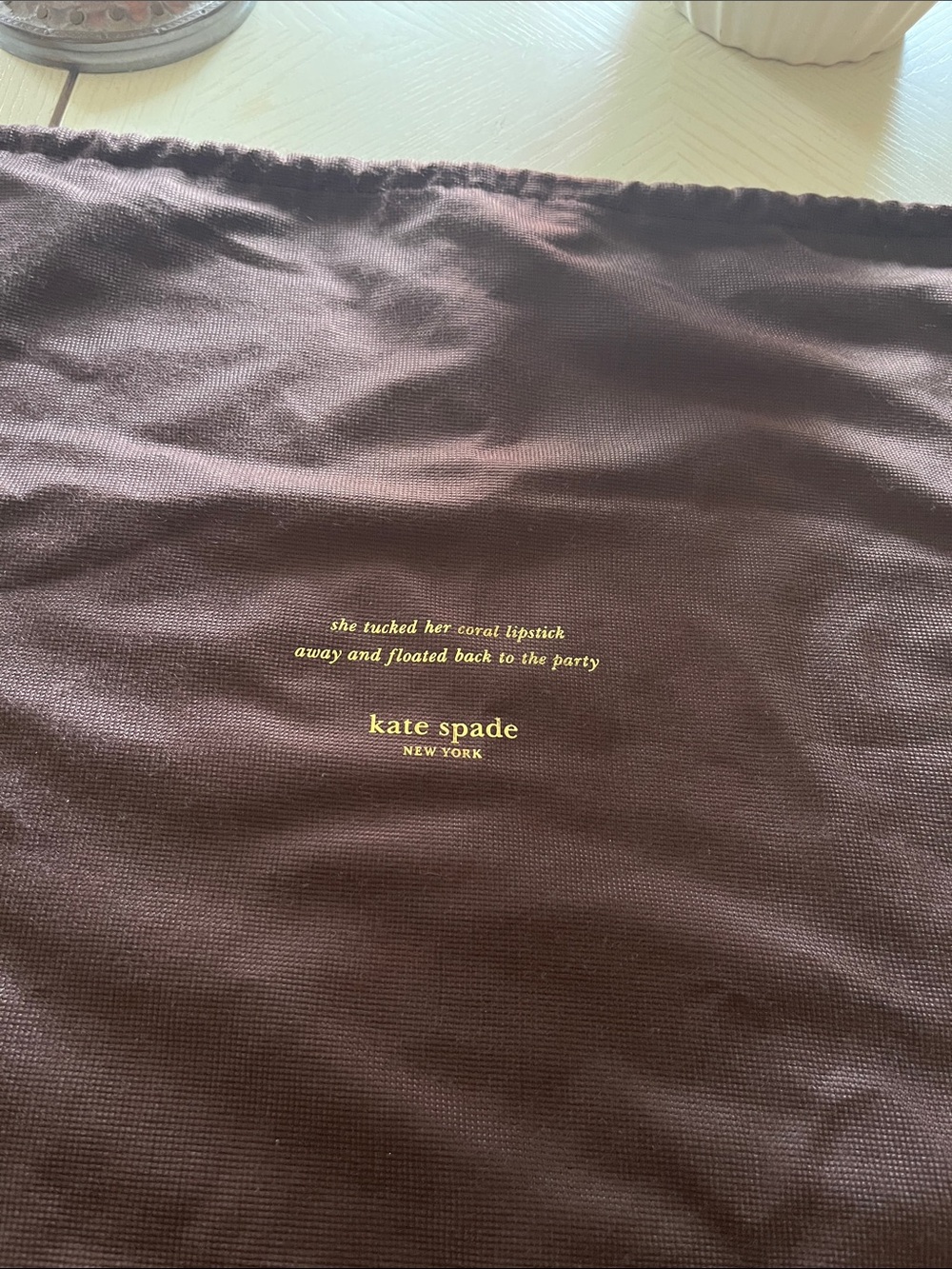 kate spade brown dust bag with gold logo text 19” x 17”